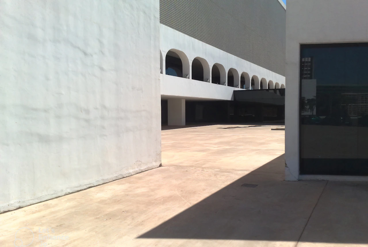 Stucco retail facade with storefront piers and parapet